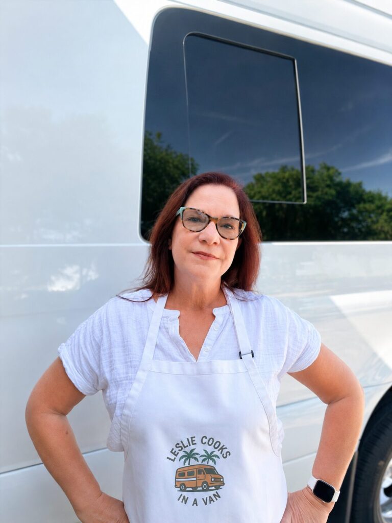 leslie standing next to a van